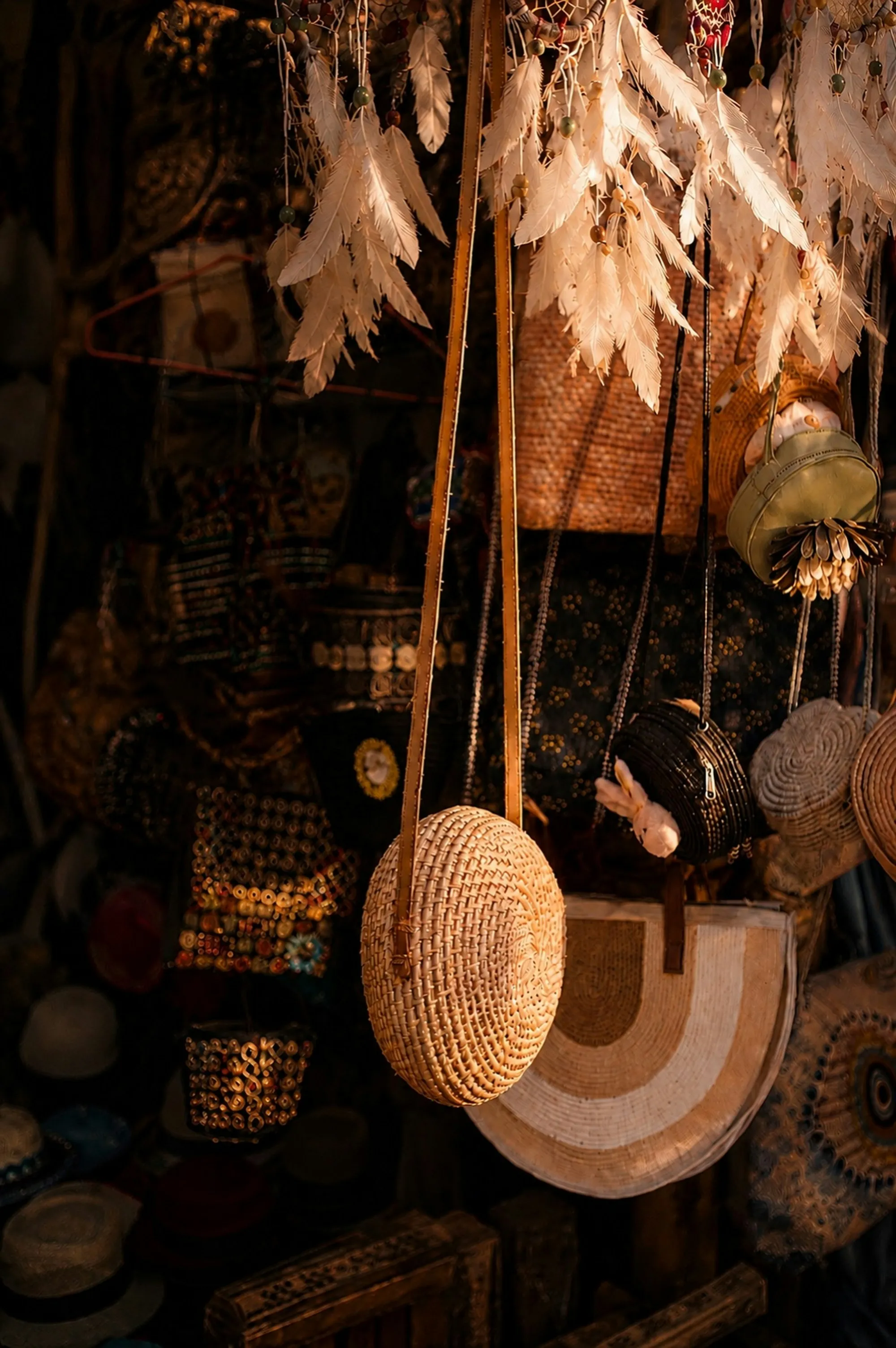 Woven bags and baskets hanging at a market stall