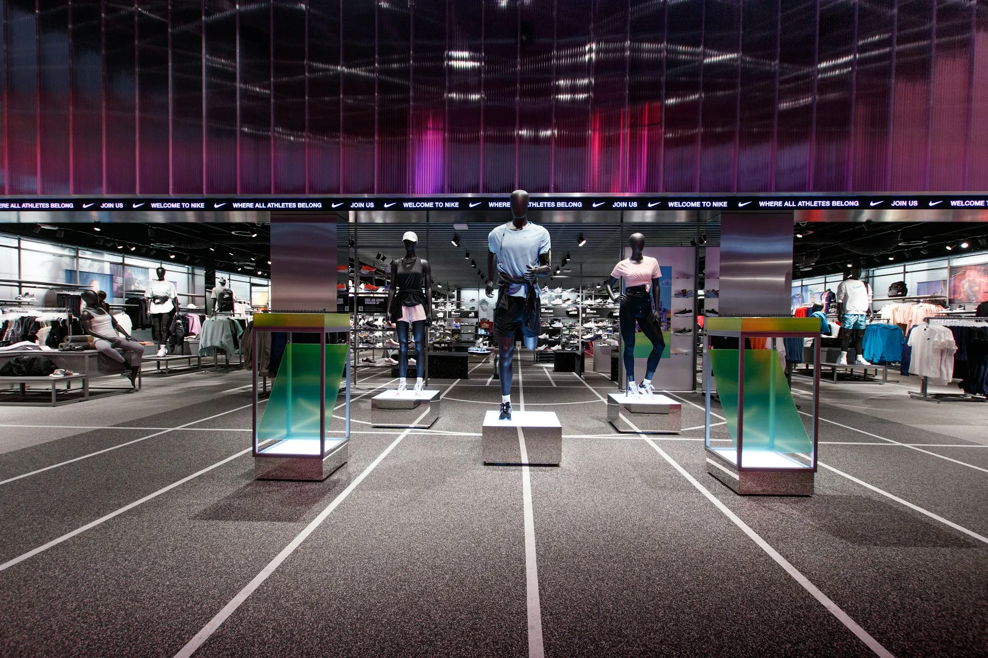Interior of a brightly lit retail shop with clothing on display