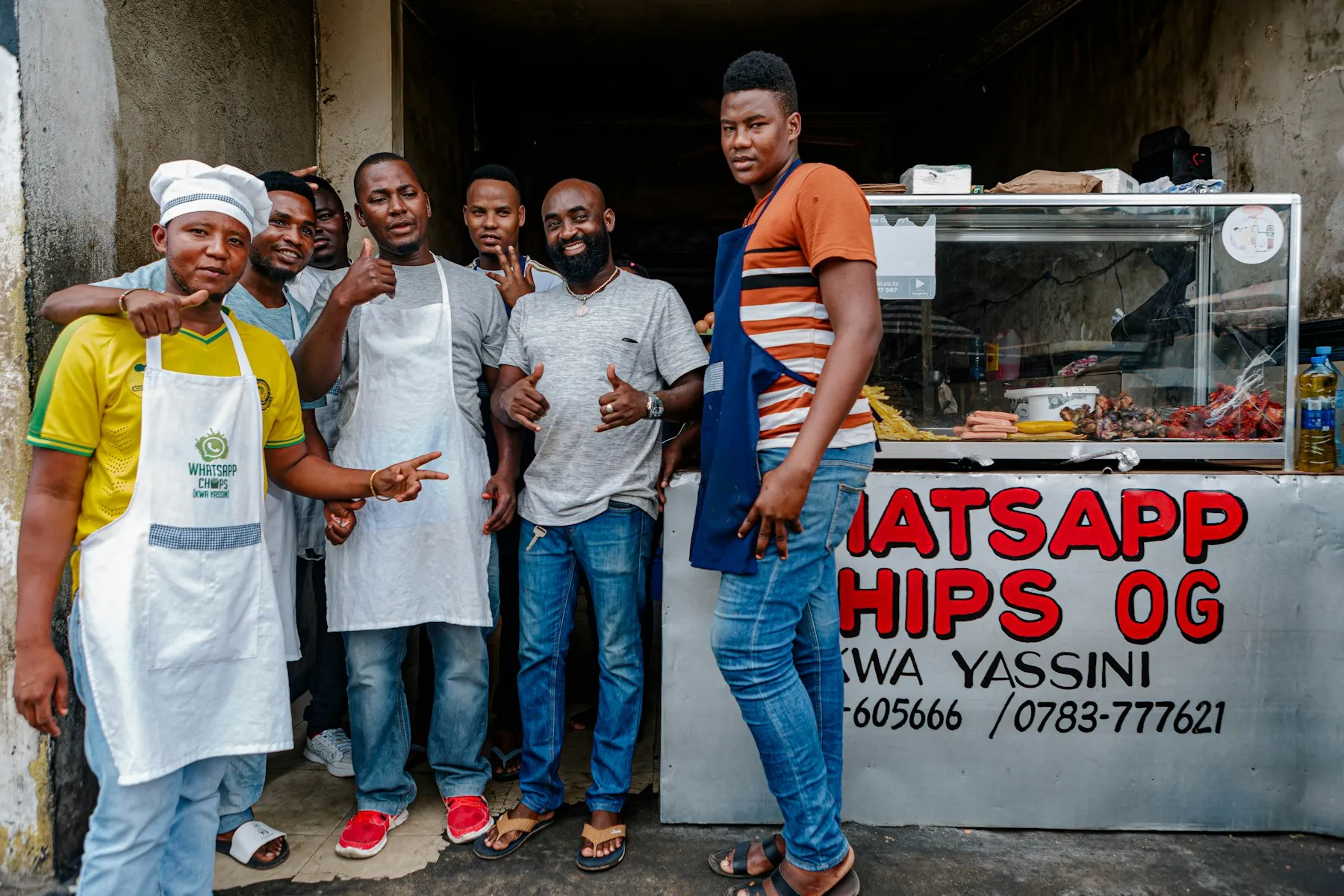 The team of a takeaway food business standing together outside their shop